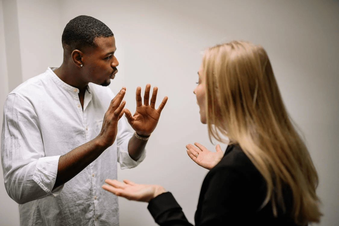 a man and a woman arguing in an office