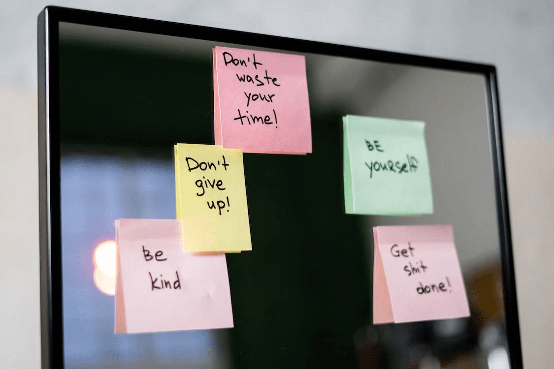 sticky notes on glass wall