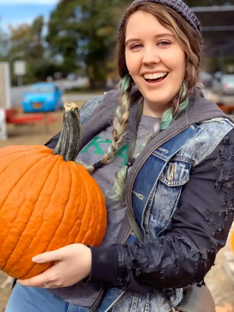 Abigail Tyson holding a pumpkin