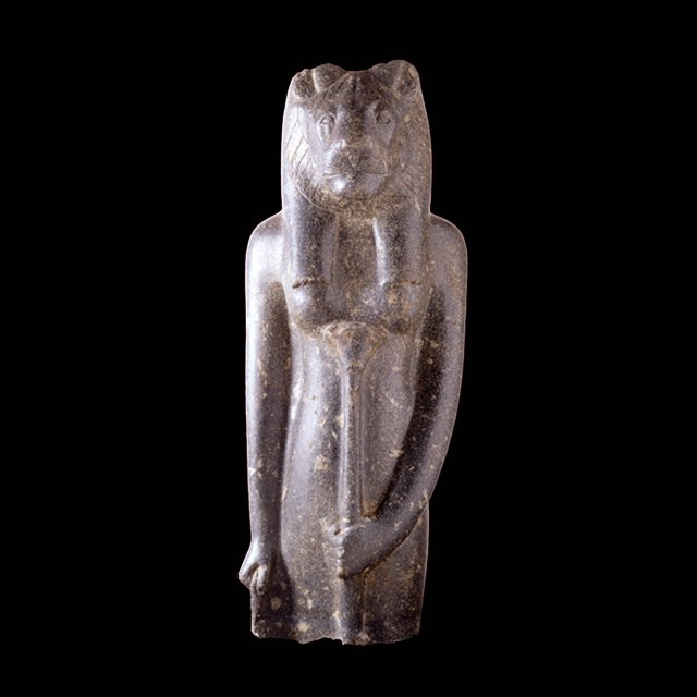 A standing statue of Sekhmet made out of porphyry.